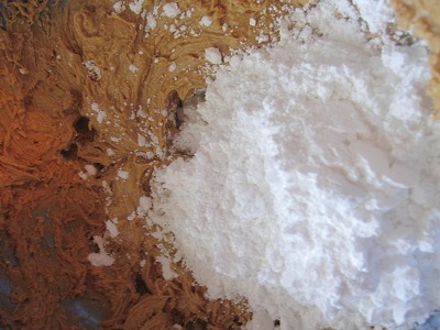 mixing peanut butter with powdered sugar