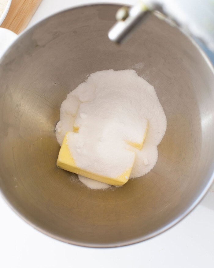 Butter and sugar in a stand mixer bowl.