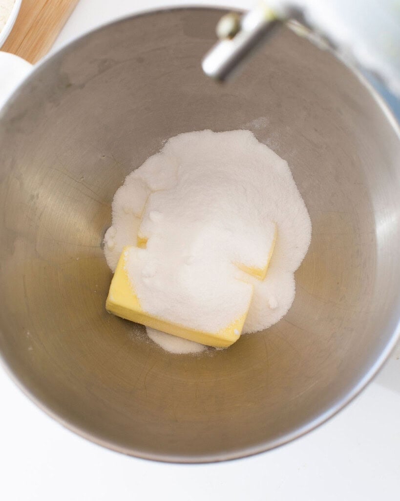 Butter and sugar in a stand mixer bowl.