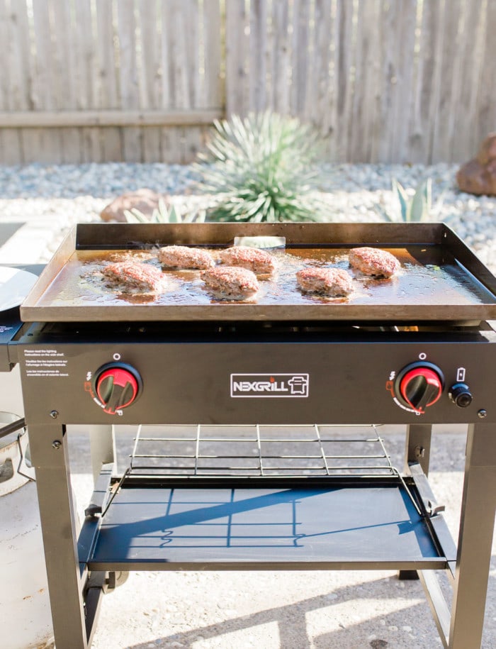 football burger patties on the grill for game day.