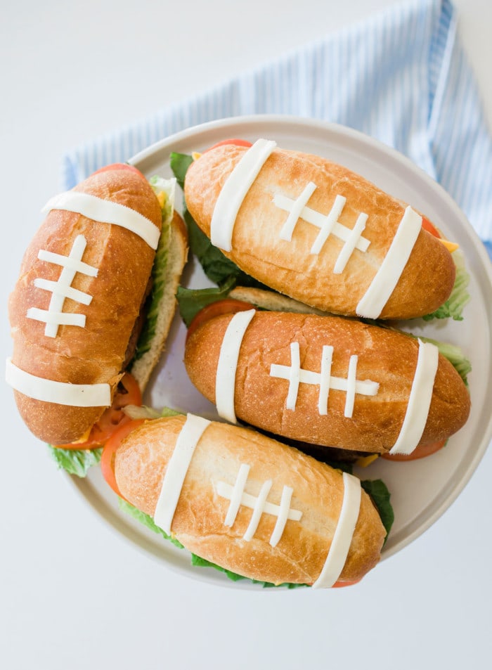 football burgers on a plate.