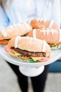 hamburger shaped food on a cake stand
