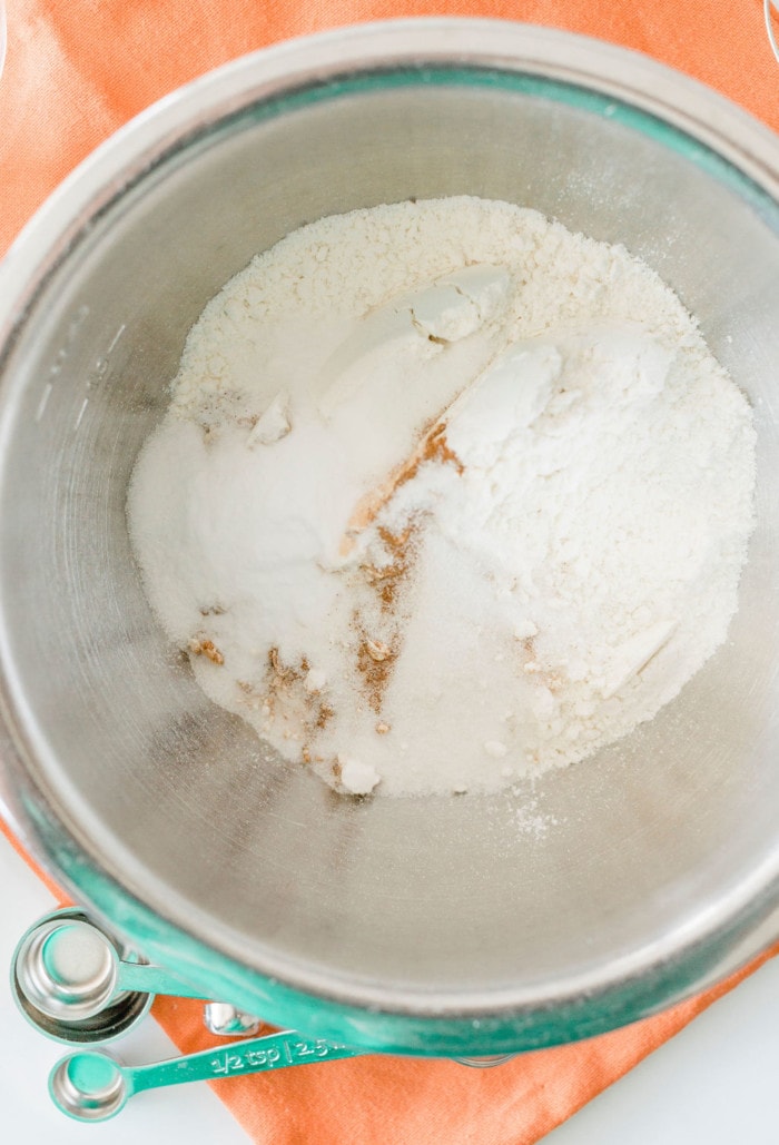Dry ingredients for pumpkin pancakes in a bowl.