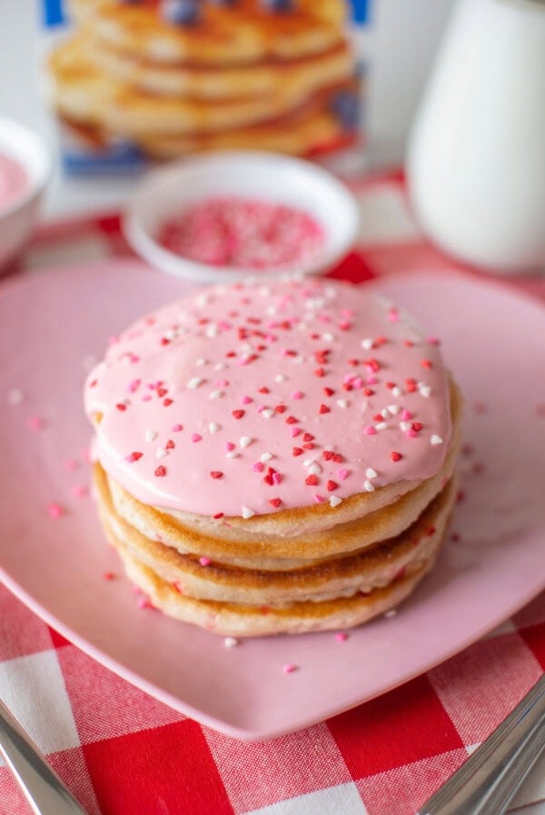 stack of valentine's pancakes on a pink plate