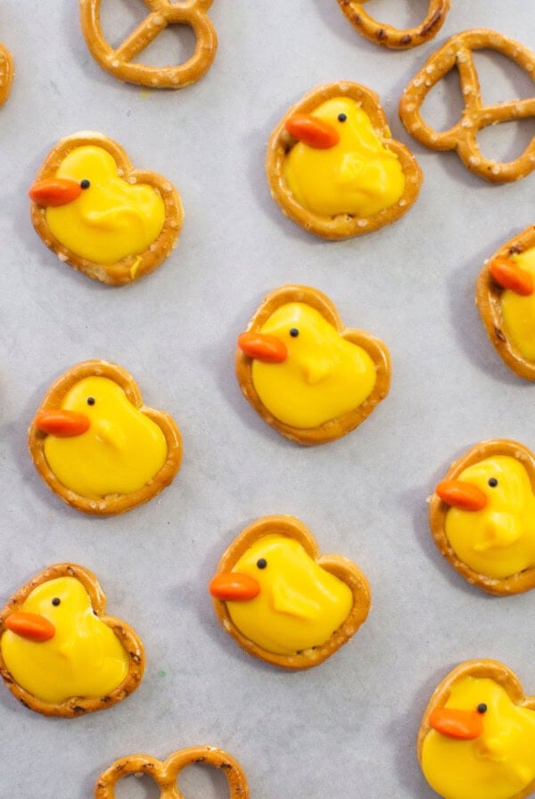 Easter pretzel duck, made from pretzels, yellow candy melts, orange candy beak, and black sprinkle eye.