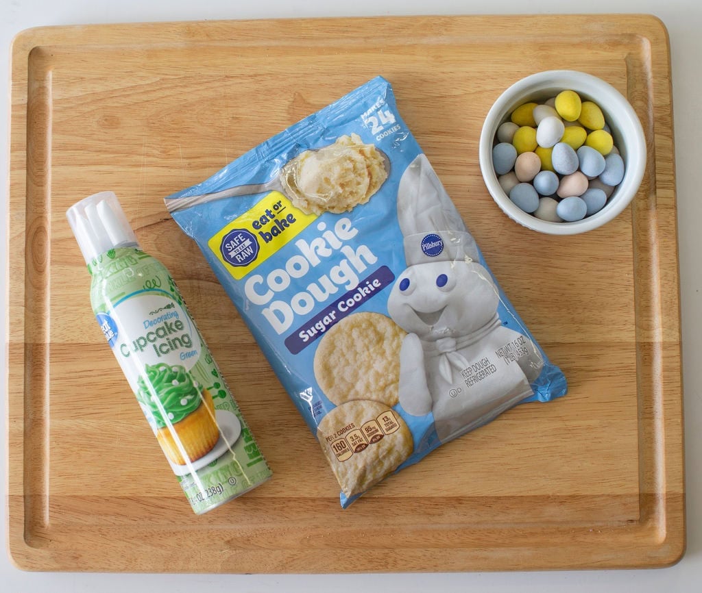 Ingredients for Easter birds nest cookie cups on a cutting board.