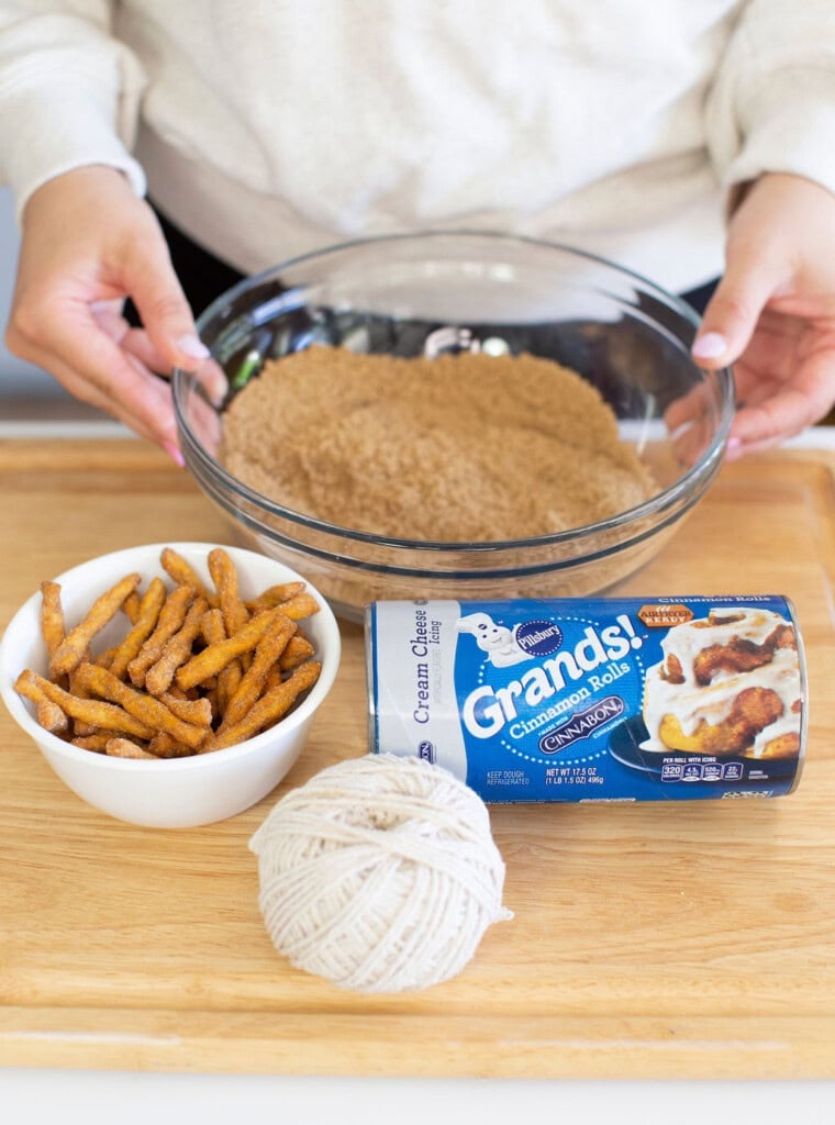Ingredients for pumpkin cinnamon rolls on a table.