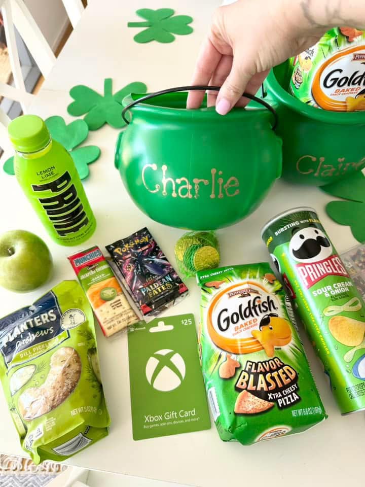 Personalized lucky bucket with name Charlie on front and treats such as xbox gift card, green prime, green Pringles, and gold coins.