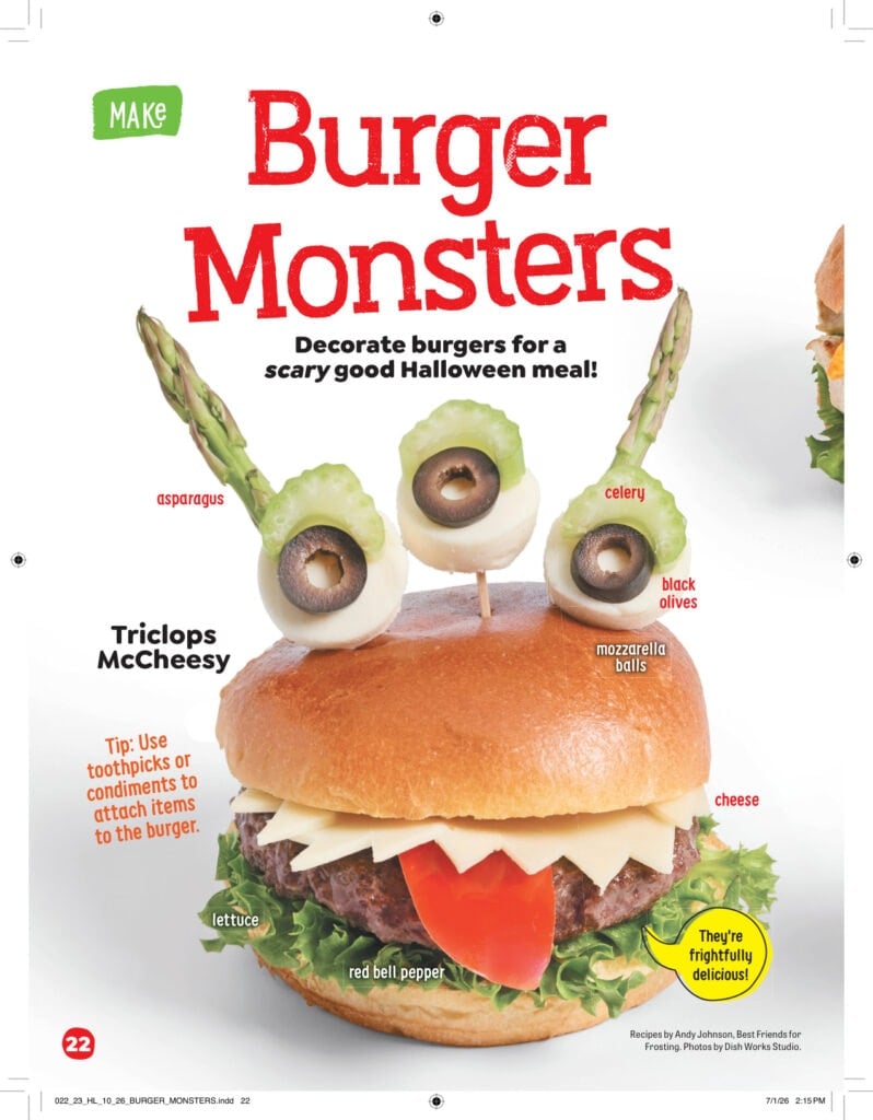A burger decorated to look like a monster, with asparagus and celery stalks for antennae, mozzarella balls and olive slices for eyes, and a red bell pepper tongue, labeled Triclops McCheesy.